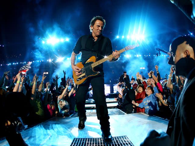 <p>Jamie Squire/Getty</p> Bruce Springsteen and the E Street Band perform at the Bridgestone halftime show during Super Bowl XLIII between the Arizona Cardinals and the Pittsburgh Steelers on February 1, 2009.