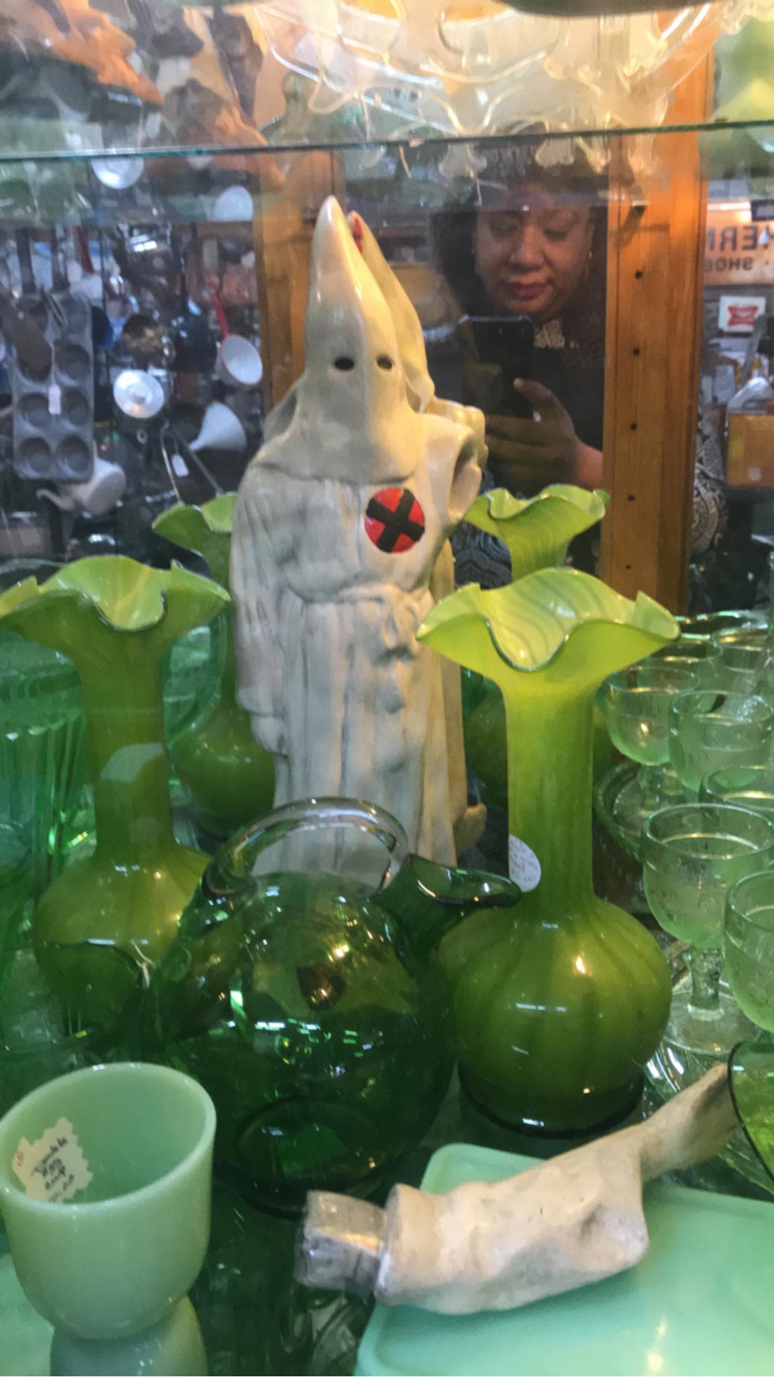 A Pensacola, Fla., shopper expressed her dismay to employees at Uncle Billy’s Antique Mall selling a KKK figurine, but the store insists it has historical value. (Photo: Facebook/Ericka Marcia Boussarhane)