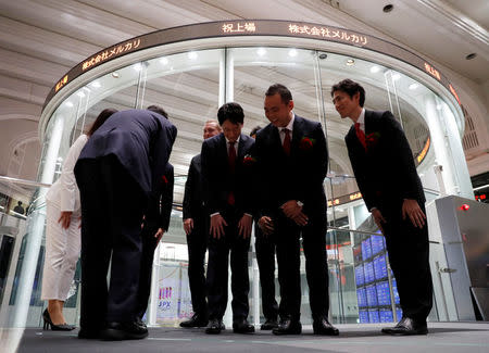 Mercari Inc. CEO Shintaro Yamada greets his executives after a ceremony to mark the company's debut on the Tokyo Stock Exchange, Tokyo, Japan, June 19, 2018. REUTERS/Kim Kyung-Hoon