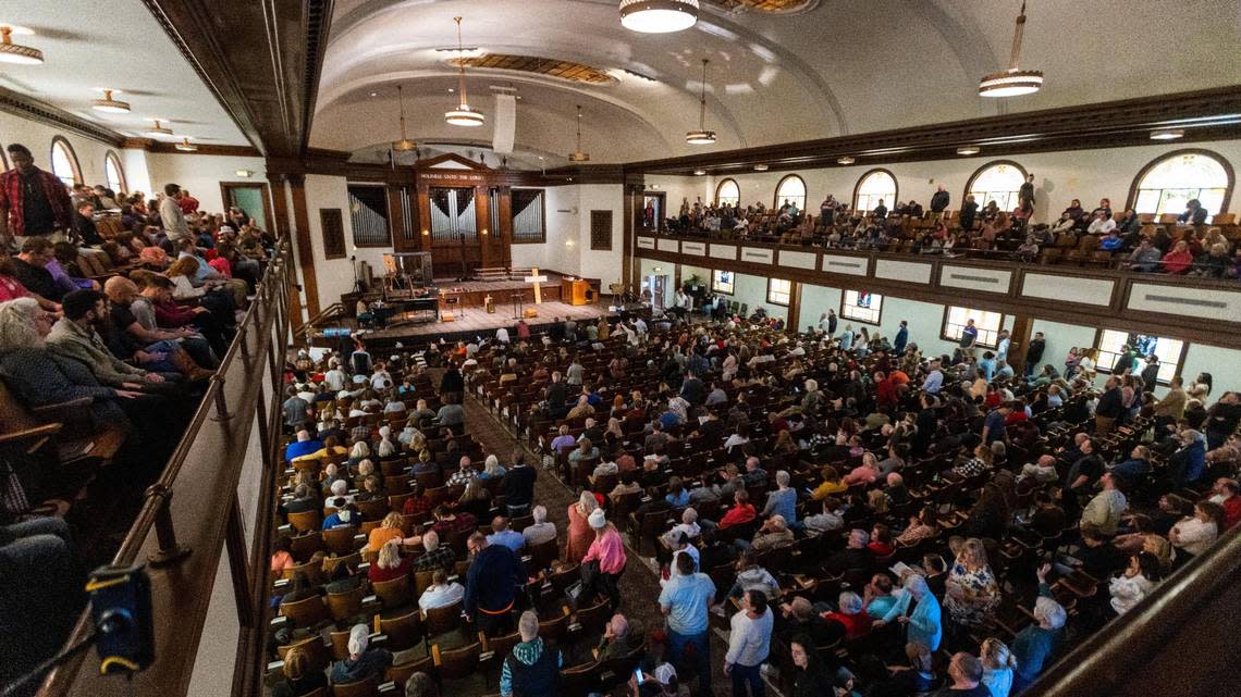 Students and visitors fill Hughes Auditorium at Asbury University singing with musicians on stage for the sixth consecutive day of a revival, February 14, 2023, which began when students stayed past normal chapel service on February 8 to continue nonstop prayer. The revival has garnered visitors from other parts of the country arriving in cars and busses to pray and sing in the auditorium.