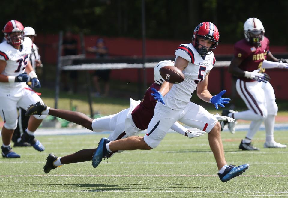 Stepinac's Gjok Dedvukaj (5) catches this pass on his way to a first half tochdown against Christ the King during football action at Archbishop Stepinac High School in White Plains Sept. 3, 2022. 
