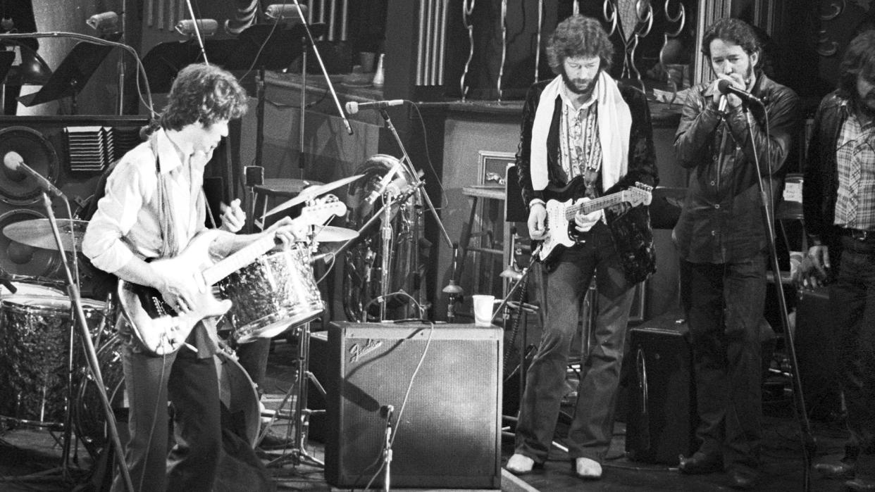  Robbie Robertson and Eric Clapton onstage in 1974 dur 