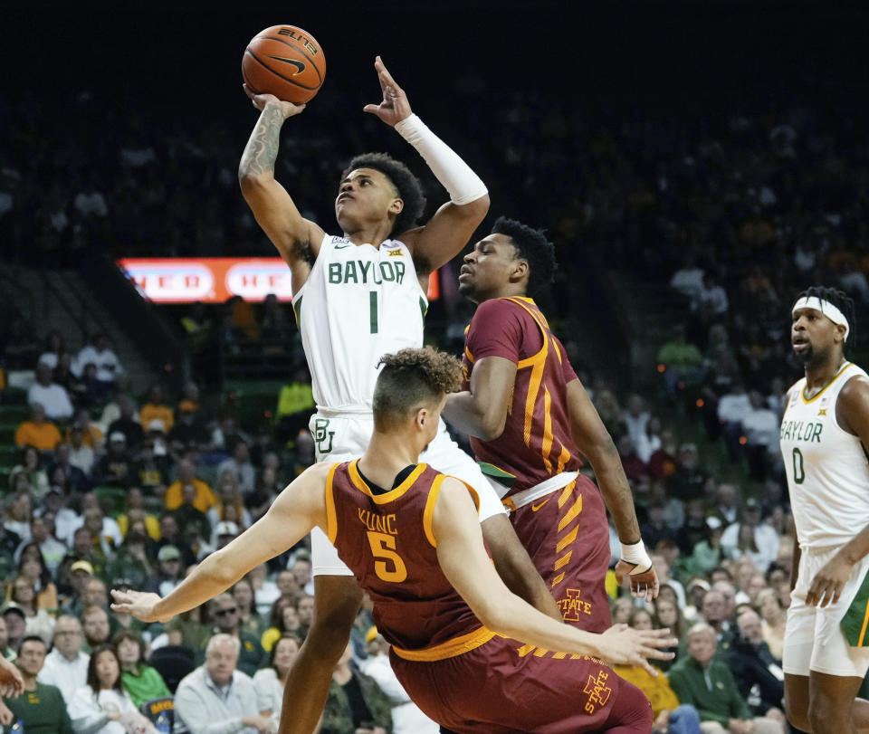 Baylor guard Keyonte George (1) scores against Iowa State forward Aljaz Kunc (5) in the first half of an NCAA college basketball game, Saturday, March 4, 2023, in Waco, Texas. (Chris Jones/Waco Tribune-Herald via AP)