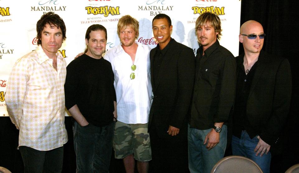 Golfer Tiger Woods (3rd R) and rock band Train (L-R) singer Pat Monahan, guitarist Rob Hotchkiss, drummer Scott Underwood, Woods, bassist Charlie Colin, and guitarist Jimmy Stafford appear after a news conference at the Tiger Jam V benefit at the Mandalay Bay Events Center April 20, 2002 in Las Vegas, Nevada. The event, put on by golfer Tiger Woods, is held to raise and distribute funds for the Tiger Woods Foundation and children's charities based in Las Vegas and Los Angeles.  (Photo by Ethan Miller/Getty Images)