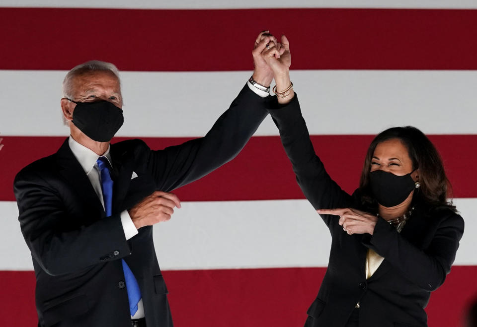 Democratic presidential candidate and former Vice President Joe Biden and U.S. Senator and Democratic candidate for Vice President Kamala Harris celebrate after Joe Biden accepted the 2020 Democratic presidential nomination during the 4th and final night of the 2020 Democratic National Convention, as participants from across the country are hosted over video links from the originally planned site of the convention in Milwaukee, Wisconsin, U.S. August 20, 2020. REUTERS/Kevin Lamarque