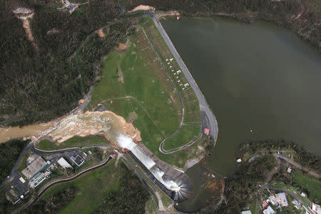 An aerial view shows the damage to the Guajataca dam in the aftermath of Hurricane Maria, in Quebradillas, Puerto Rico September 23, 2017. REUTERS/Alvin Baez