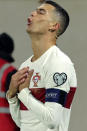 Portugal's Cristiano Ronaldo reacts after scoring the opening goal during the Euro 2024 group J qualifying soccer match between Luxembourg and Portugal at the Stade de Luxembourg in Luxembourg, Sunday, March 26, 2023. (AP Photo/Olivier Matthys)