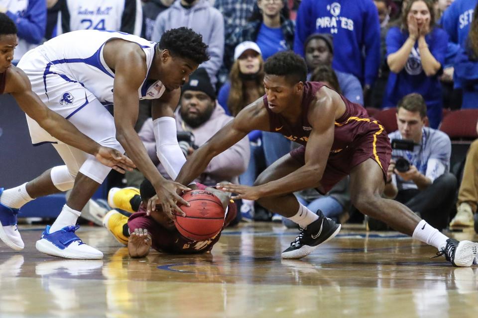 Seton Hall Pirates forward Alexis Yetna (10) and Bethune-Cookman Wildcats guard Damani McEntire (5) fight for a loose ball in the first half at Prudential Center.