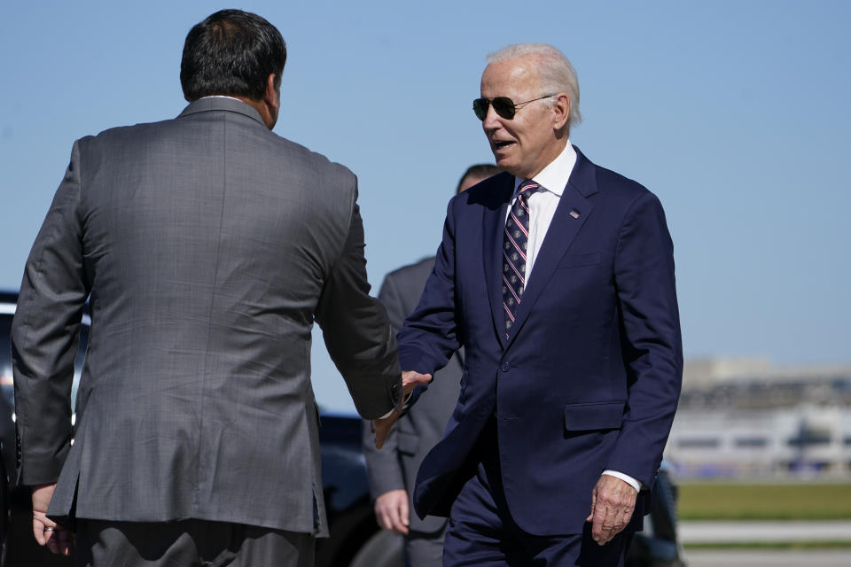 President Joe Biden shakes hands with Columbus Mayor Andrew Ginther as he arrives at Columbus International Airport in Columbus, Ohio, Friday, Sep. 9, 2022, on his way to a groundbreaking for a new Intel computer chip facility in New Albany, Ohio. (AP Photo/Manuel Balce Ceneta)