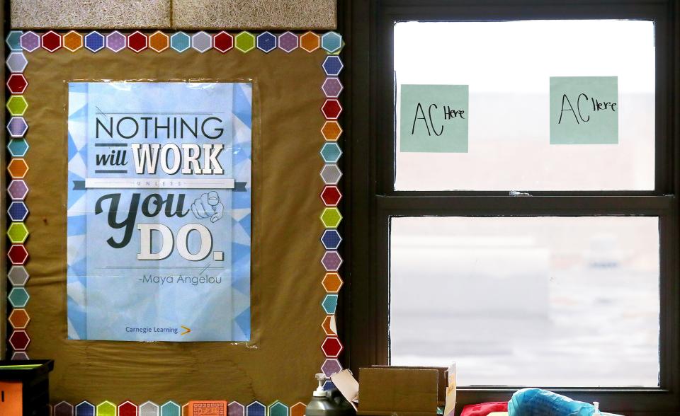 Some North High School teachers have hung signs requesting window air-conditioning units for the school year.