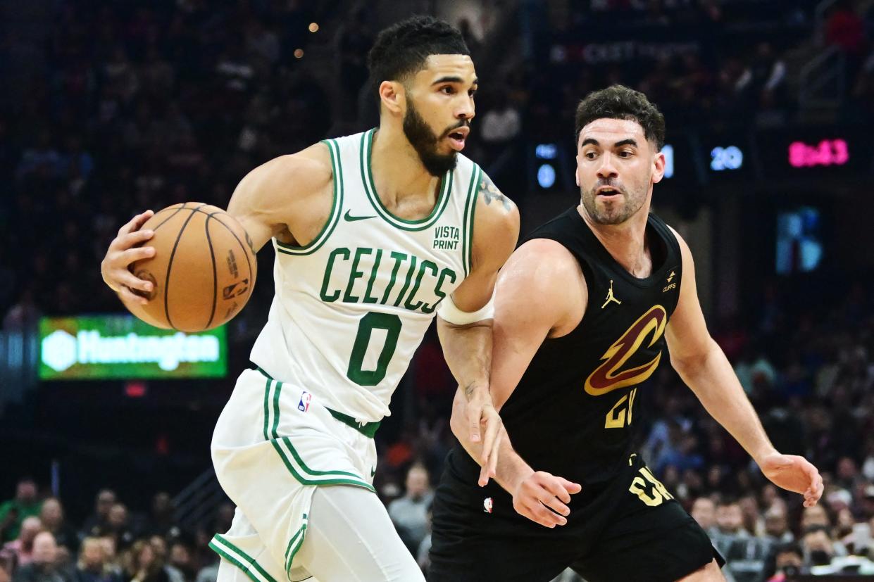 Celtics forward Jayson Tatum drives to the basket against Cavaliers forward Georges Niang during the first half, March 5, 2024, in Cleveland.
