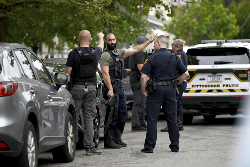 Pittsburgh police and other law enforcement personnel respond to gunfire in the Garfield neighborhood of Pittsburgh on Wednesday, Aug. 23, 2023. (Teagan Staudenmeier/Pittsburgh Post-Gazette via AP)