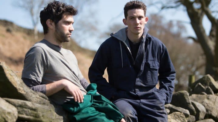 Alec Secǎreanu and Josh O'Connor as Gheorghe and Johnny looking to the distance in the film Gods Own Country.