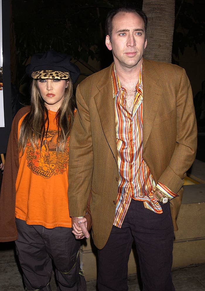 Nicolas Cage and Lisa Marie Presley on a red carpet holding hands