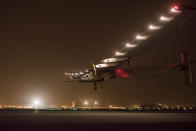 <p>Solar Impulse 2 lands with pilot Andre Boschberg at the helm to finish the first leg of its historic round-the-world journey that began in Abu Dhabi on 9 March 2015. (Jean Revillard via Getty Images)</p>