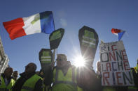 Yellow vest protesters demonstrate peacefully in downtown Marseille, southern France, Saturday, Jan. 12, 2019. Authorities deployed 80,000 security forces nationwide for a ninth straight weekend of anti-government protests. (AP Photo/Claude Paris)