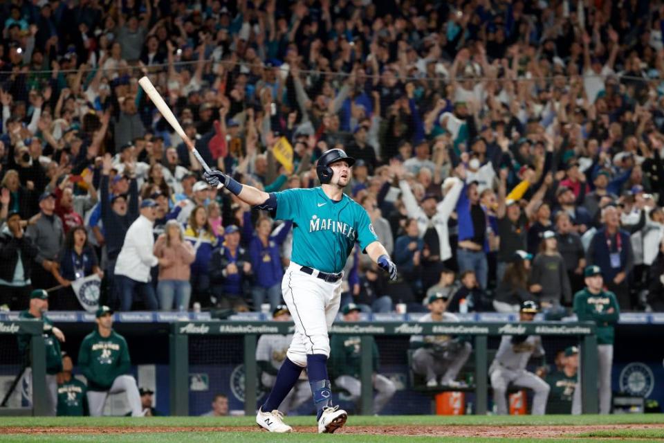 SEATTLE, WASHINGTON - SEPTEMBER 30: Cal Raleigh #29 of the Seattle Mariners celebrates his walk-off home run during the ninth inning against the Oakland Athletics at T-Mobile Park on September 30, 2022 in Seattle, Washington. With the win, the Seattle Mariners have clinched a postseason appearance for the first time  in 21 years, the longest playoff drought in North American professional sports. (Photo by Steph Chambers/Getty Images)