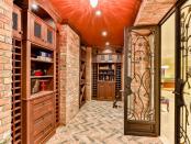 The basement has a bar, games, and a wine cellar. (Zoocasa)