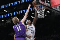 Brooklyn Nets center Day'Ron Sharpe (20) goes to the basket against Phoenix Suns center Jock Landale (11) during the first half of an NBA basketball game, Tuesday, Feb. 7, 2023, in New York. (AP Photo/Mary Altaffer)