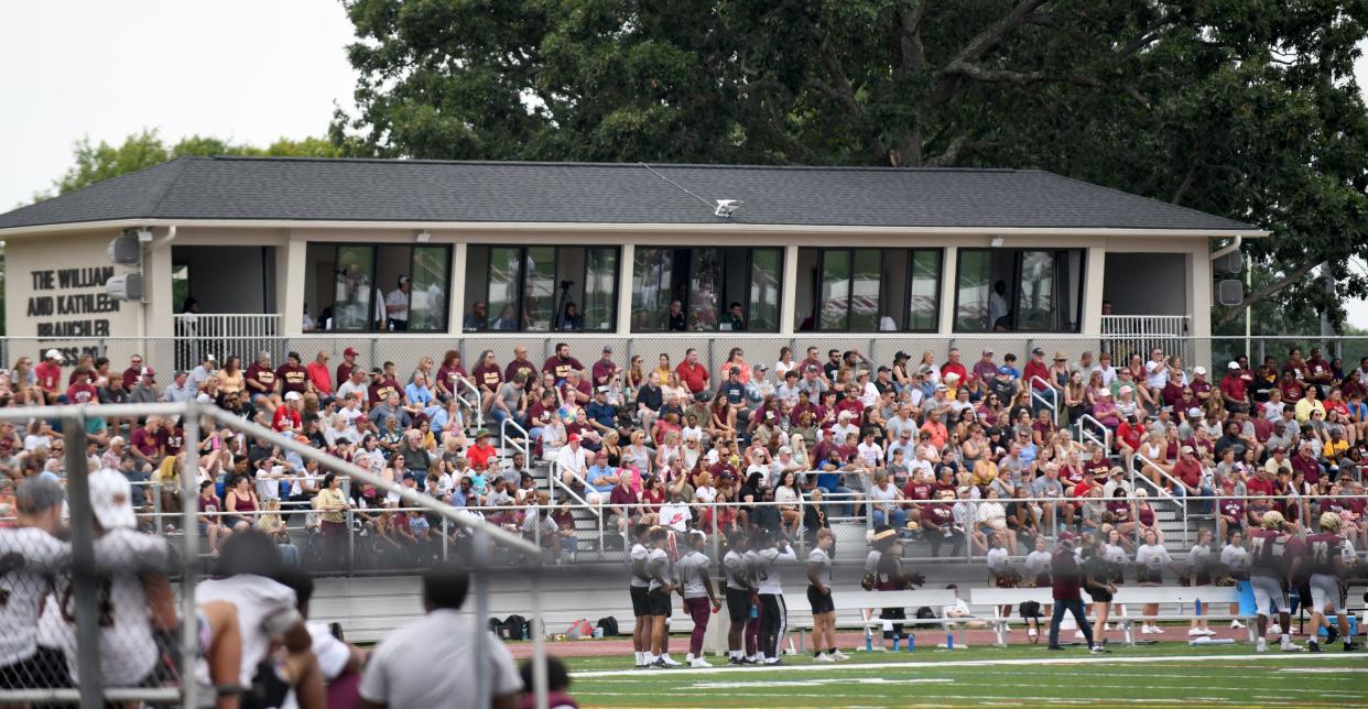 Alumni, students and local fans fill the stands Saturday afternoon as Walsh University plays its first regular-season football game on campus in the new Larry Staudt Field.