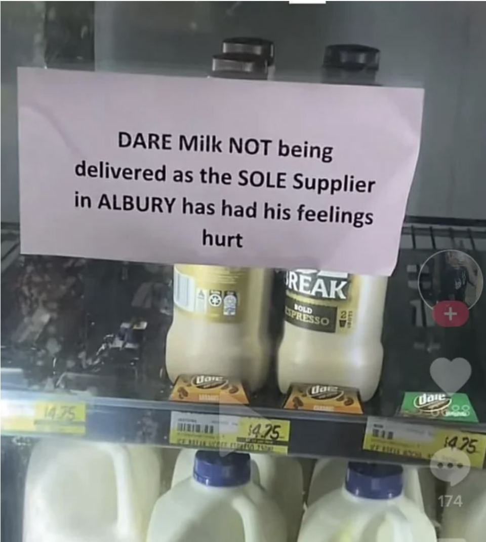 "DARE Milk NOT being delivered as the SOLE Supplier in Albury has had his feelings hurt" sign on the door of the milk section