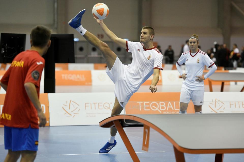 Hungary serves to Spain in a mixed doubles match at the Teqball World Championships.