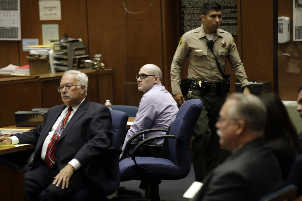 Michael Gargiulo, center, sits next to his attorney Dale Rubin, left, during closing arguments in the trial of People vs. Michael Gargiulo Wednesday, Aug. 7, 2019, in Los Angeles. Closing arguments continued Wednesday in the trial of the air conditioning repairman charged with killing two Southern California women and attempting to kill a third. (AP Photo/Marcio Jose Sanchez, Pool)