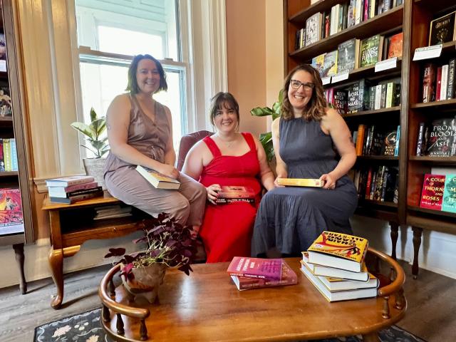 Owners Jessica Callahan, from left, Austin Carter, and Julie Ross pose at Pocket Books Shop in Lancaster, Pa., on Sunday, May 21, 2023. The independent bookselling community continues to grow, with membership in the American Booksellers Association reaching its highest levels in more than 20 years. Callahan, Carter and Ross opened their store last year. (Sophia DeRise/Pocket Books via AP)