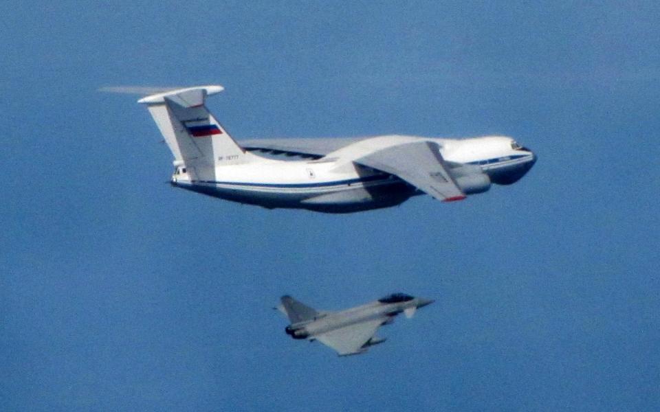 A Russian Air Force IL-76 Candid aircraft being shepherded near Nato airspace by an RAF Typhoon fighter that had scrambled from the Amari air base in Estonia.  - RAF