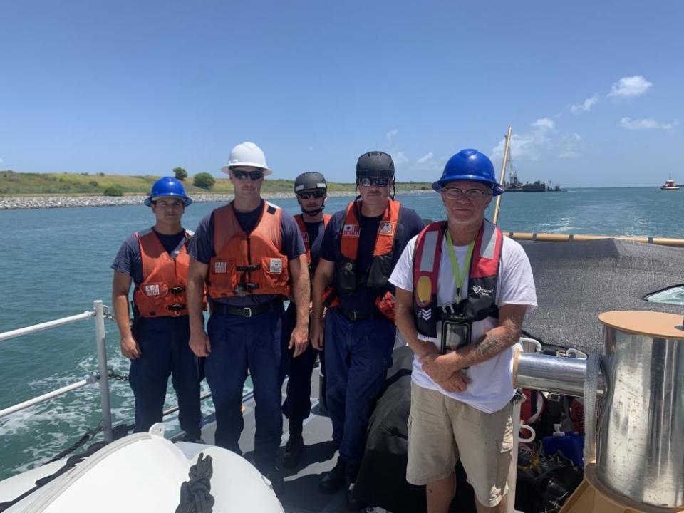 The U.S. Coast Guard rescued Steven Hicks, right, in August 2022 after his boat capsized in the Atlantic Ocean, 69 miles east of New Smyrna Beach, Fla., thanks to his emergency beacon.