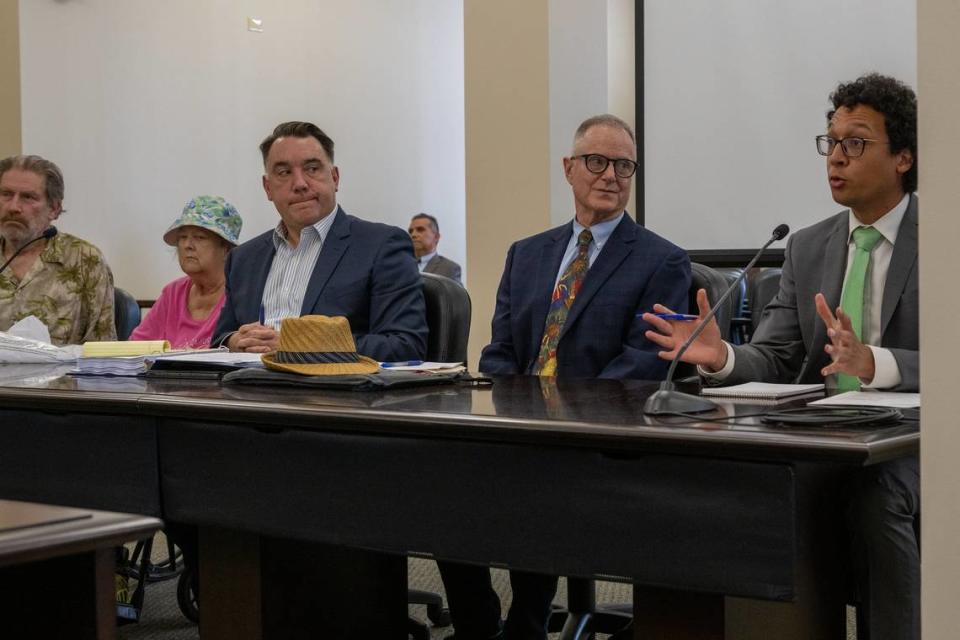 Kevin Kuninger, right, with the Sacramento city attorney’s office, speaks at a Sacramento Superior Court hearing on May 18 to decide whether Linda Siegrist, second from left, can keep her childhood home. Gerard Keena and Dan Collins of the Bay Area Receivership Group, which was hoping the judge would rule to sell the home, listen at center.