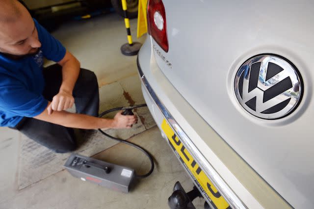 Embargoed to 0001 Wednesday November 8 File photo dated 24/09/15 of a Volkswagen car being tested for its exhaust emissions, as new figures show that a third of Volkswagen cars fitted with software to cheat emissions tests remain unfixed.