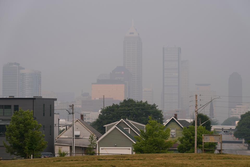 A thick haze caused by Canadian wildfire smoke obscures the view of downtown Indianapolis on Wednesday, June 28, 2023, as seen from Highland Park on the city's east side.