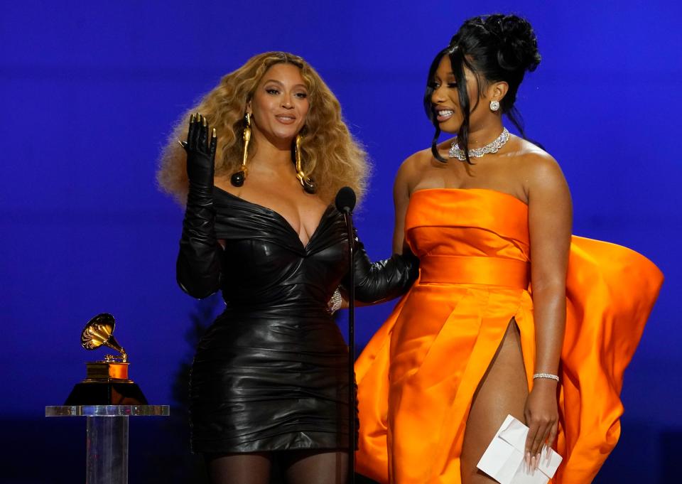 Beyonce (left) and Megan Thee Stallion accept the award for best rap song for "Savage" at the 63rd annual Grammy Awards.