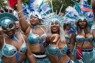 <p>The grand finale (Monday Parade) of the Notting Hill Carnival, during which performers present their costumes and dance to the rhythms of the mobile sound systems or steel bands along the streets of West London. (Photo: Wiktor Szymanowicz / Barcroft Media via Getty Images) </p>