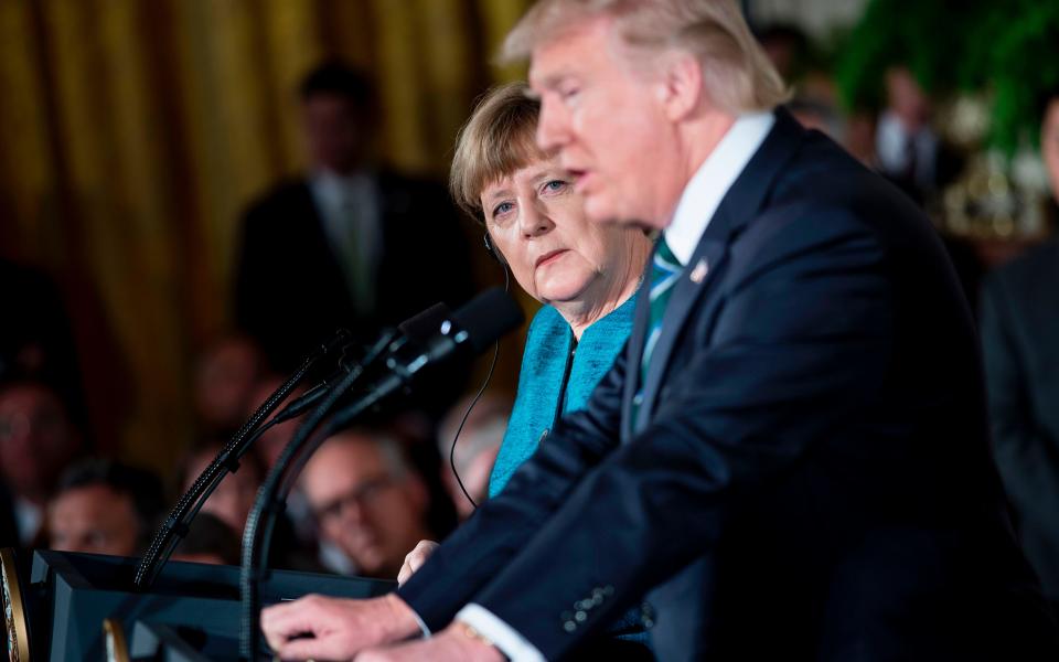 merkel Trump - Credit: AFP