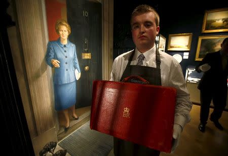 An employee holds The Prime Ministerial Dispatch Box, part of the collection of former British prime minister Margaret Thatcher during an auction preview at Christie's in London, Britain, December 11, 2015. REUTERS/Peter Nicholls