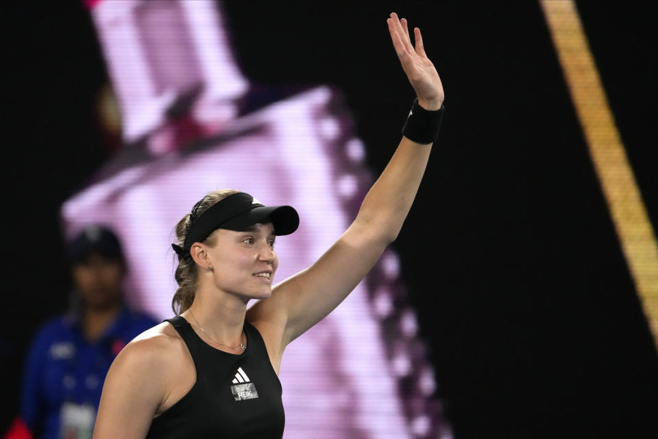 Elena Rybakina of Kazakhstan waves after defeating Victoria Azarenka of Belarus in their semifinal match at the Australian Open tennis championship in Melbourne, Australia, Thursday, Jan. 26, 2023. (AP Photo/Ng Han Guan)