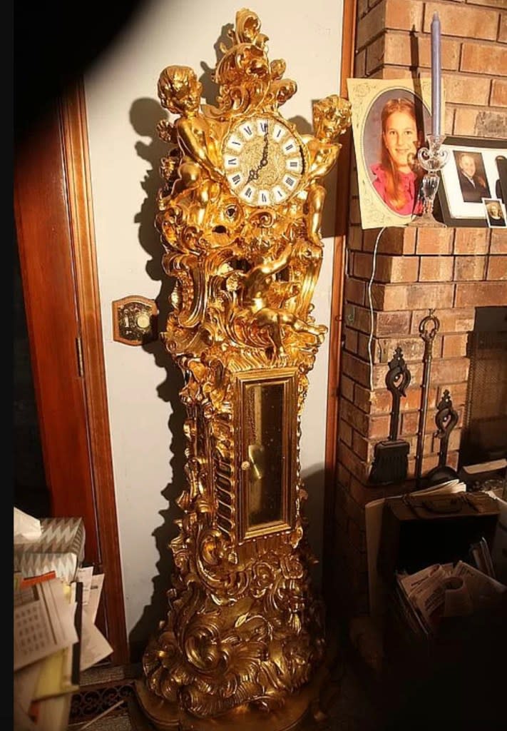 The sale includes furnishings, such as a gold-plated grandfather clock. Bruce Remington