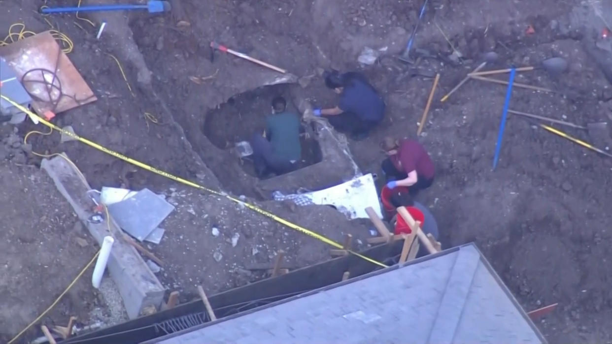 A car was found buried Thursday, Oct. 20, 2022, in the yard of a home in the San Francisco Bay Area town of Atherton, and may have been there since the 1990s, Atherton police said. (NBC Bay Area)