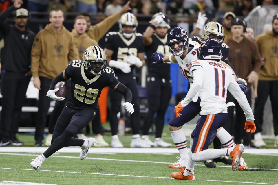 New Orleans Saints cornerback Paulson Adebo (29) runs after intercepting a pass during the first half of an NFL football game against the Chicago Bears in New Orleans, Sunday, Nov. 5, 2023. (AP Photo/Butch Dill)