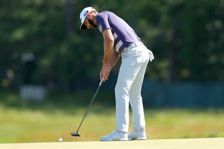 Jun 16, 2018; Southampton, NY, USA; Dustin Johnson putts the second green during the third round of the U.S. Open golf tournament at Shinnecock Hills GC - Shinnecock Hills Golf C. Brad Penner-USA TODAY Sports