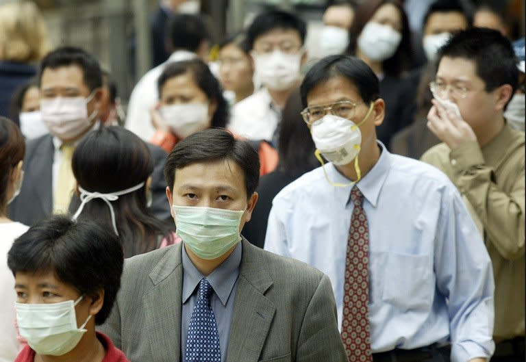 People wear masks in Hong Kong on March 31, 2003, during the SARS outbreak. Severe Acute Respiratory Syndrome (SARS) was the first "new" disease of the 21st century to jump from an animal host to humans, then easily from one person to another