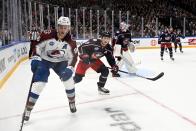 Mikko Rantanen, left of Colorado Avalanche vies with Zach Werenski of Columbus Blue Jackets, during the 2022 NHL Global Series ice hockey match between Colorado Avalanche and Columbus Blue Jackets in Tampere, Finland, Saturday, Nov. 5, 2022. (Emmi Korhonen./Lehtikuva via AP)