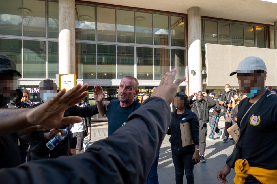 A crowd of people look on. (Vincenzo Lullo/SWNS)