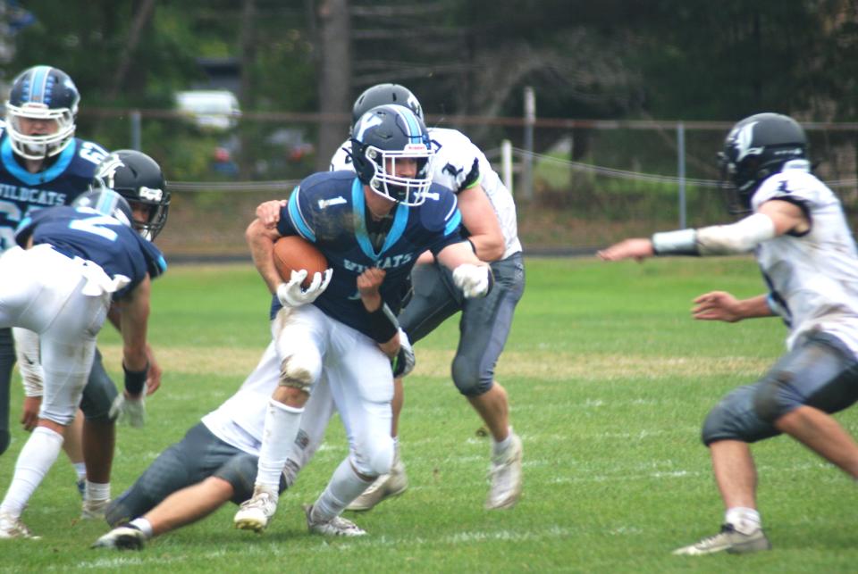 York's Brady Higgins fights through a tackle during one of his six catches for 123 yards and a touchdown in York's 41-20 win over Lisbon on Saturday afternoon.