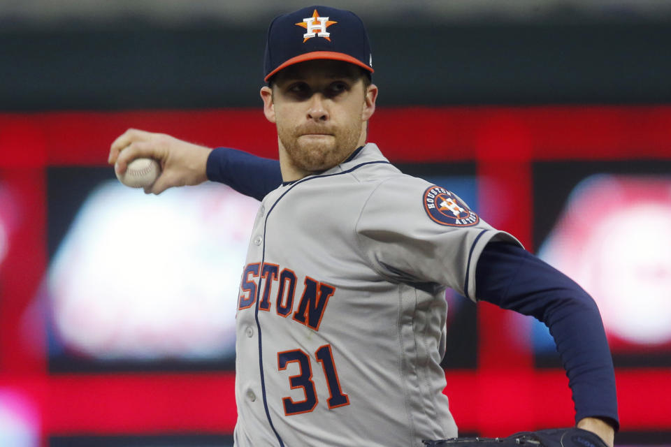 FILE - In this May 1, 2019, file photo, Houston Astros pitcher Collin McHugh throws against the Minnesota Twins in the first inning of a baseball game in Minneapolis. McHugh agreed to a $600,000, one-year contract with the pitching-needy Boston Red Sox, a deal that allows him earn up to $4.25 million. (AP Photo/Jim Mone, File)