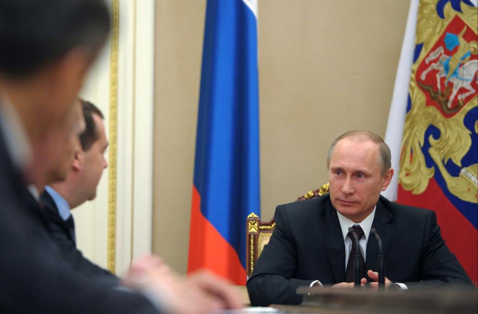 Russian President Vladimir Putin chairs a meeting with Security Council members in the Kremlin in Moscow, Russia, Friday, March 21, 2014. There is no need for Russia to further retaliate against U.S. sanctions, President Vladimir Putin said Friday as Russia's upper house of parliament endorsed the annexation of Crimea from Ukraine. (AP Photo/RIA-Novosti, Alexei Druzhinin, Presidential Press Service)