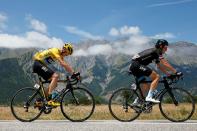 FILE PHOTO: Team Sky riders Geraint Thomas of Britain and Chris Froome of Britain, race leader's yellow jersey, cycle during the 18th stage of the 102nd Tour de France cycling race