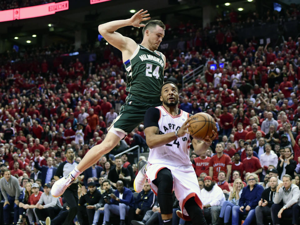 Toronto Raptors forward Norman Powell (24) heads for the baskets as Milwaukee Bucks guard Pat Connaughton (24) defends during the second half of Game 4 of the NBA basketball playoffs Eastern Conference finals, Tuesday, May 21, 2019 in Toronto. (Frank Gunn/The Canadian Press via AP)